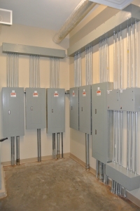 Vertical image of a 6-panel electrical upgrade for a commercial wiring project.